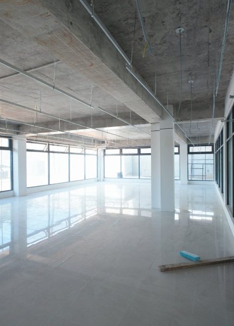 Open-plan Block A unit with tiled floor and full-height windows