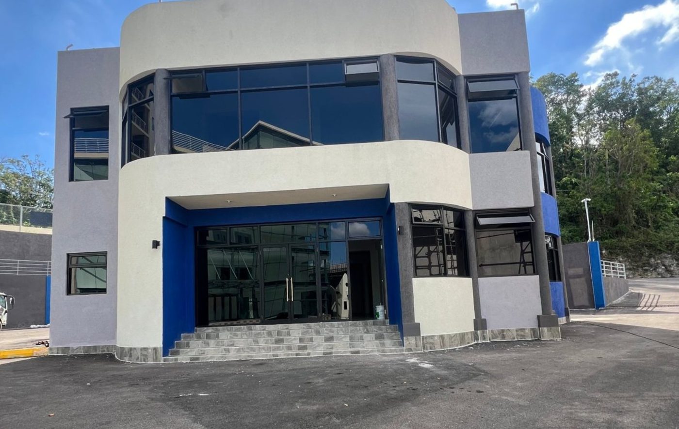Completed Block D standalone building with blue entrance