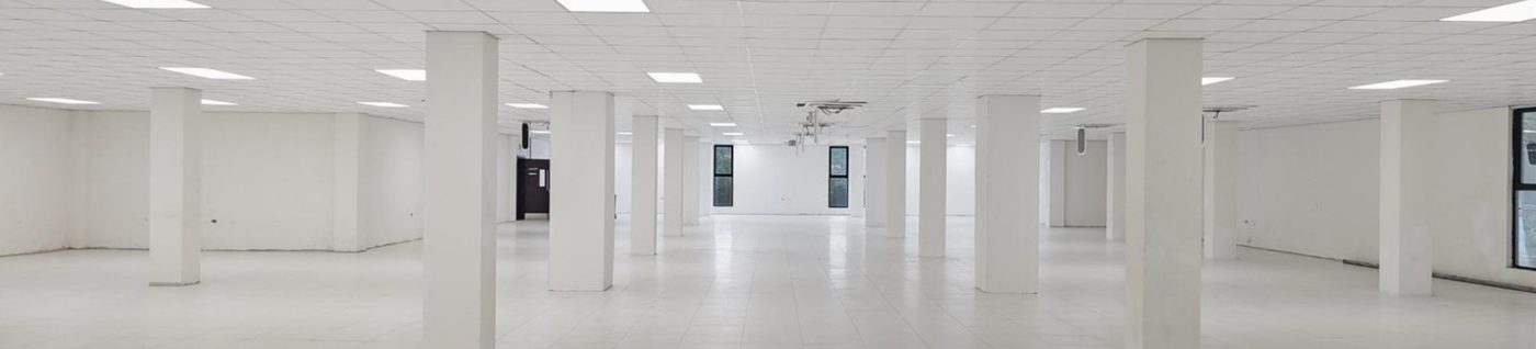 Tiled open-plan office floor in Block E